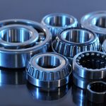 Closeup,View,Of,Several,Ball-bearings,In,Blue,Light