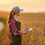 Woman,Farmer,Agronomist,Working,In,Grain,Field,And,Planning,Income